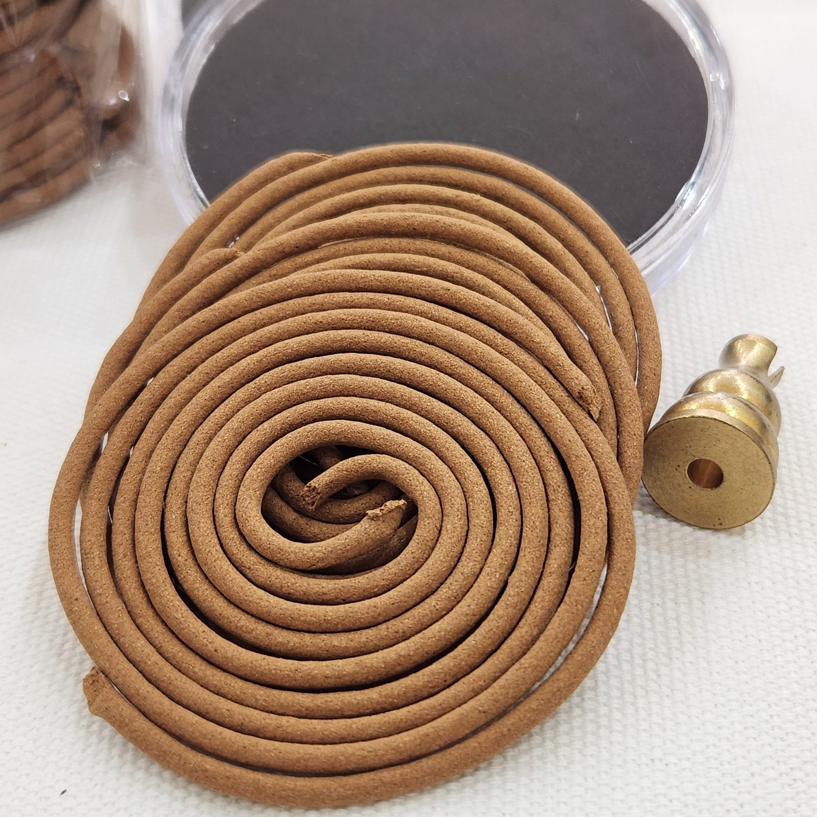Red Lotus incense coil set in use