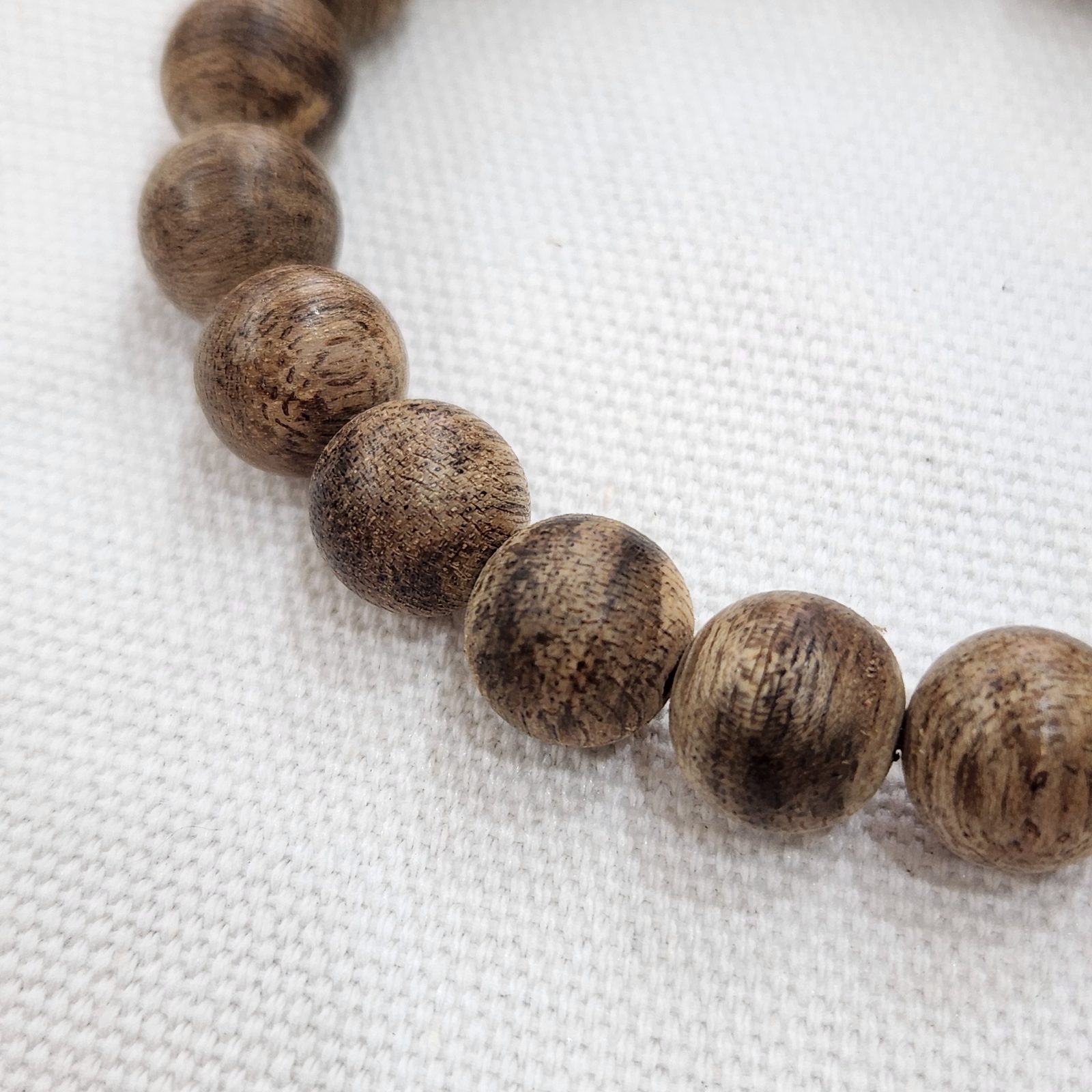 Close-up of resin-rich agarwood beads