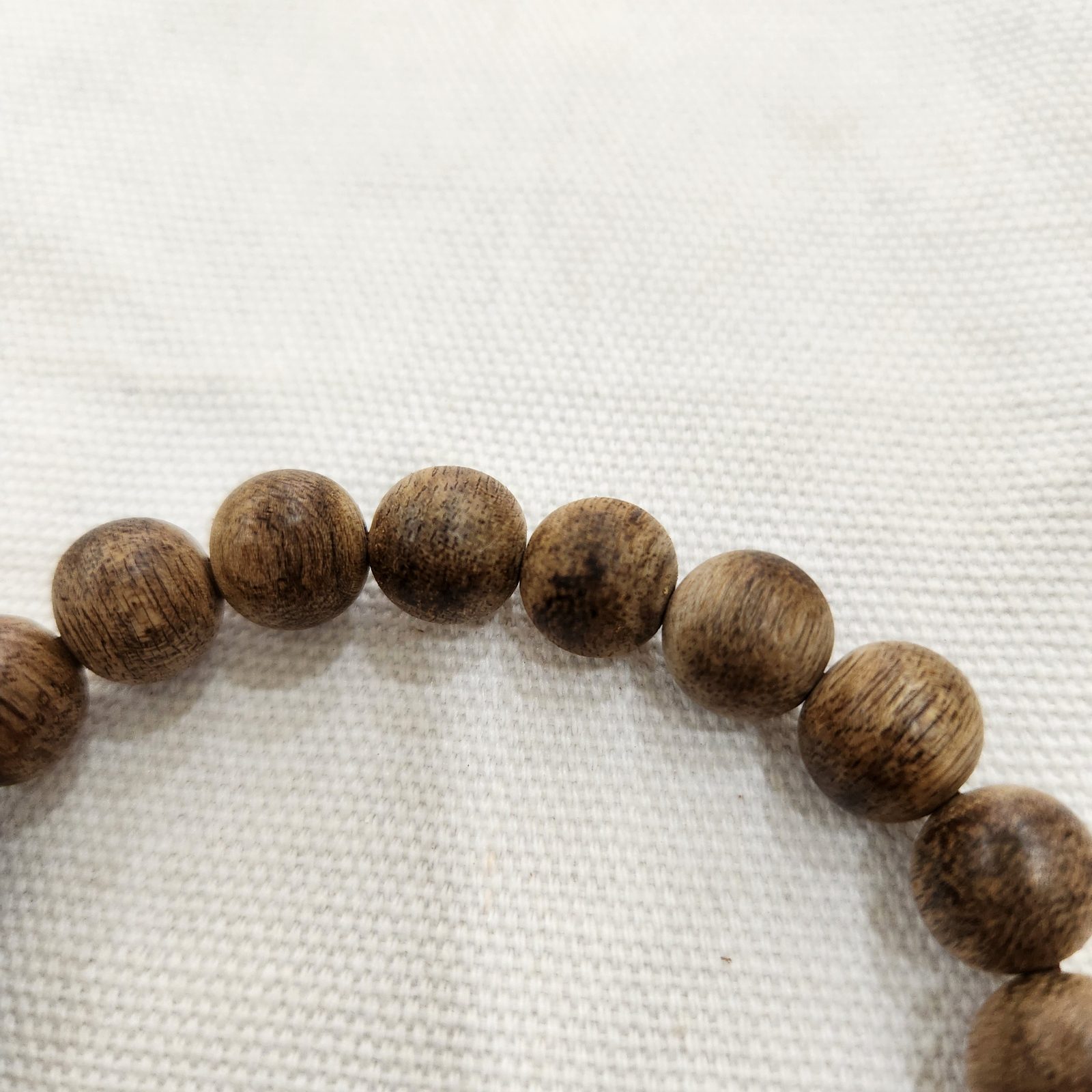 Detail of the 10 mm agarwood beads