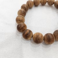 17-Bead Agarwood Bracelet 12 mm – ant-worked agarwood with bright natural wood tones photo 4